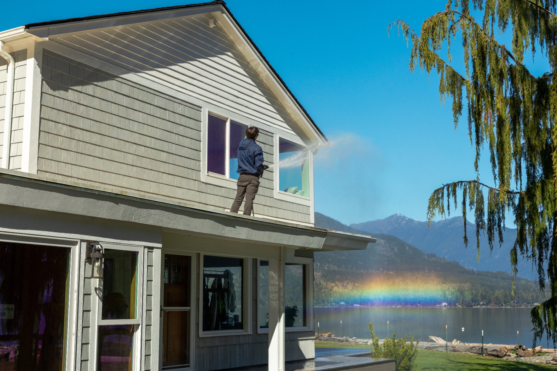 Sound Exterior Solutions soft washing the exterior siding of a Kitsap County home